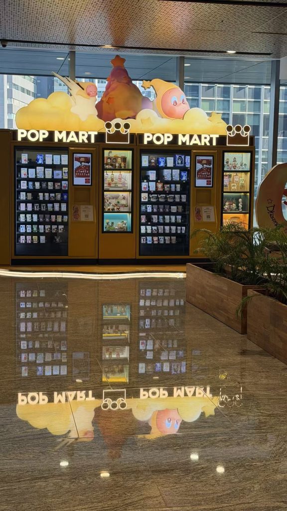Crystal Shield stone care performance on marble floor in Indonesia mall reflecting Pop Mart vending machine.